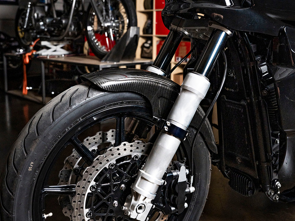 Carbon Front Fender - Gloss Finish. Fits Mid-Glide Dyna 2006-2017, Softail Street Bob 2018up & Standard 2020-2024 with 19in. Front Wheel. Also Fits Softail Low Rider S 2020up & Low Rider ST 2022up with Adapter
