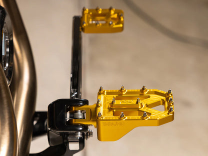 Aggressor Footpegs - Gold. Fits Softail 2018up Front Rider